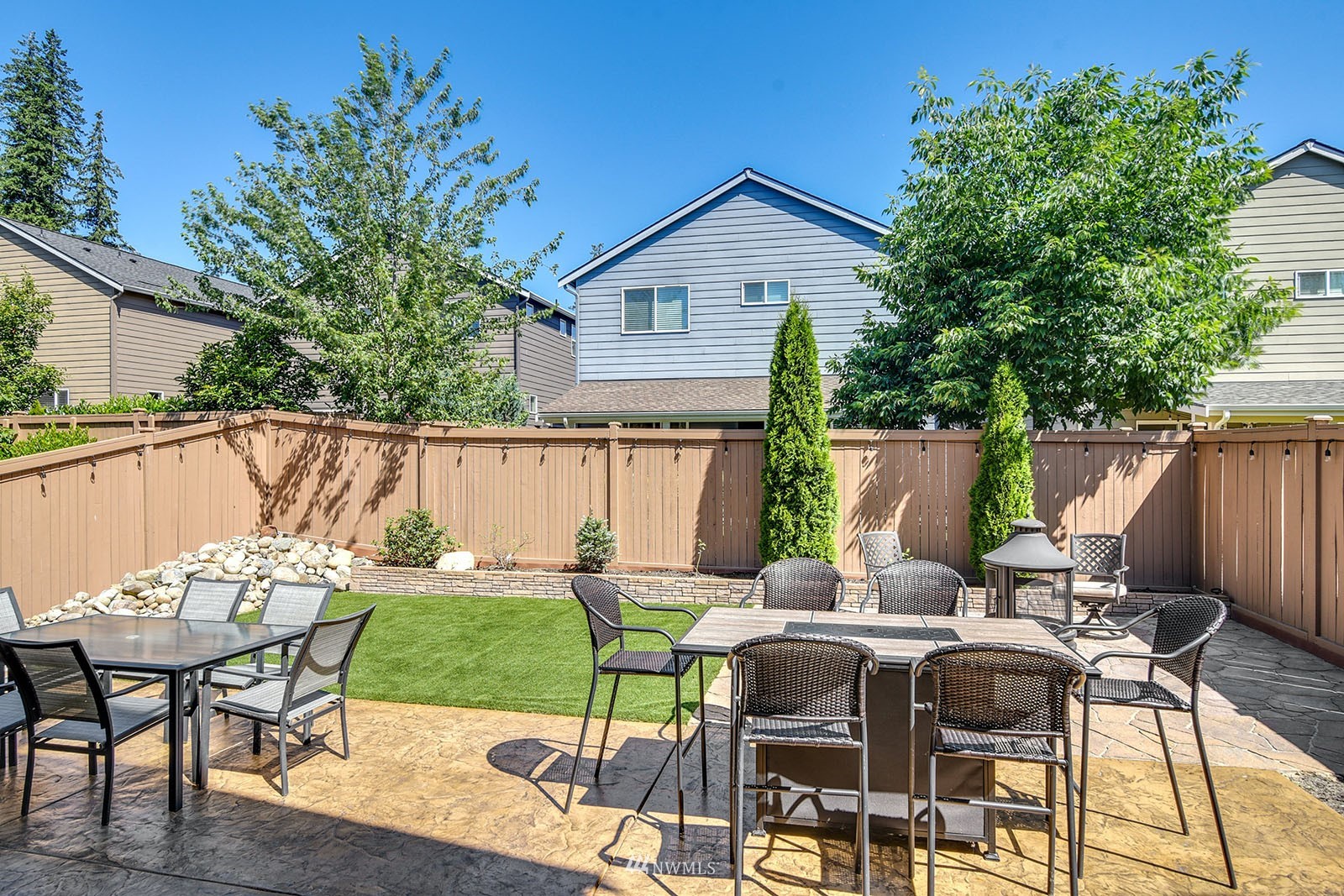 24220 Southeast 258th Way Maple Valley, WA 98038 - Photo 24 of 28 a view of a patio with couple of chairs