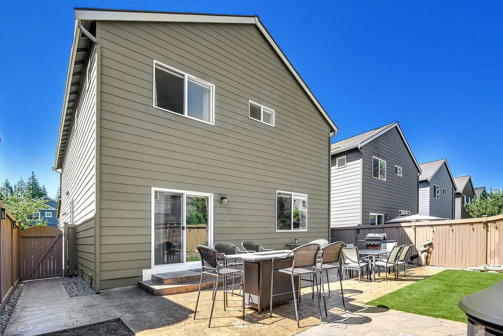 24220 Southeast 258th Way Maple Valley, WA 98038 - Photo 26 of 28 a backyard of a house with outdoor seating
