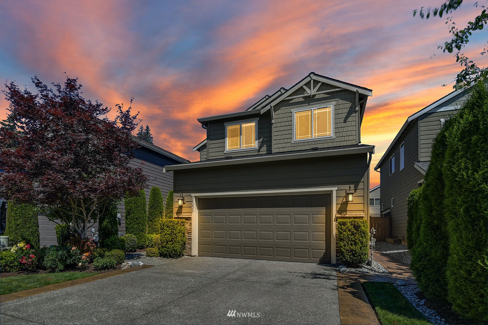 24220 Southeast 258th Way Maple Valley, WA 98038 - Photo 27 of 28 a view of a house with a small yard and a large window
