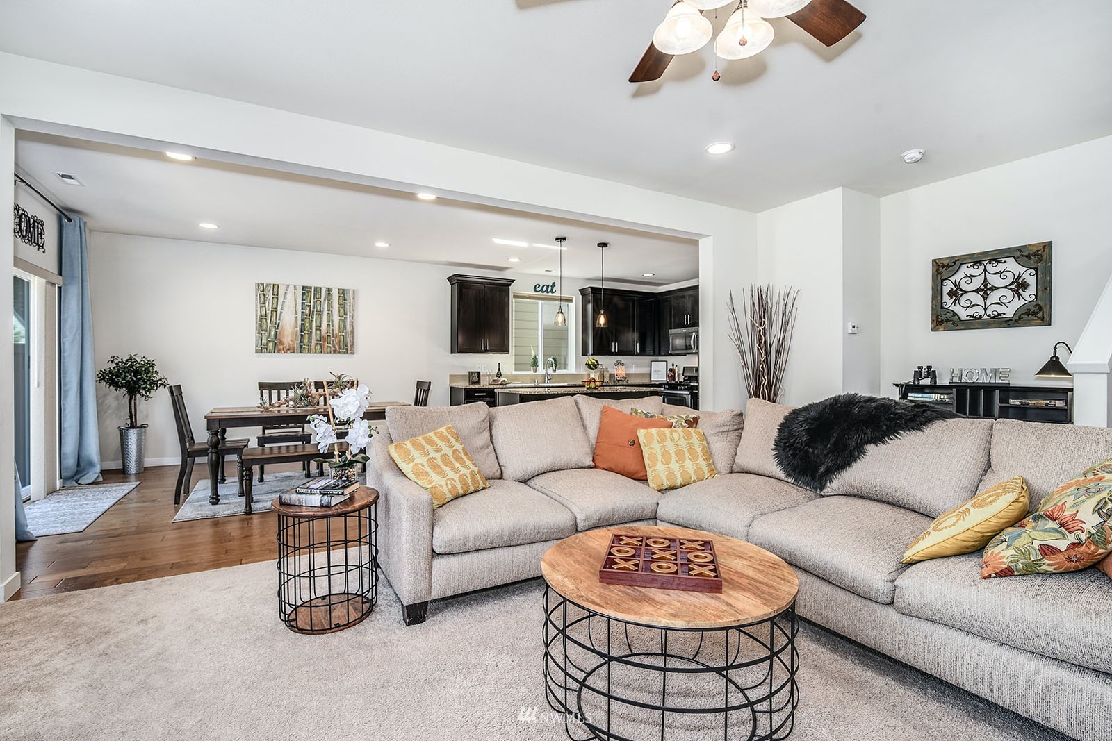 24220 Southeast 258th Way Maple Valley, WA 98038 - Photo 5 of 28 a living room with furniture and a view of kitchen