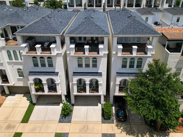 a front view of residential houses and street