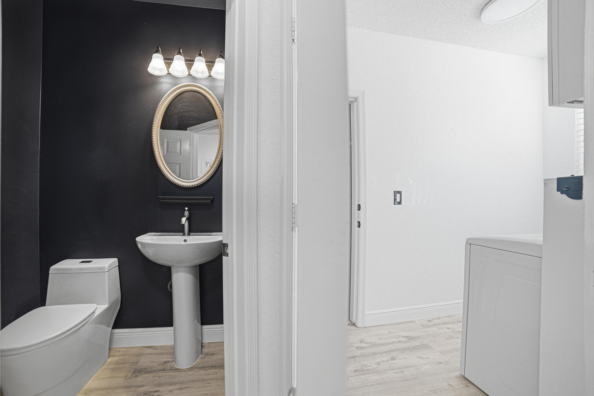 4819 Northwest 53rd Circle Pompano Beach, FL 33073 - Photo 18 of 48 Guest Bathroom-Laundry