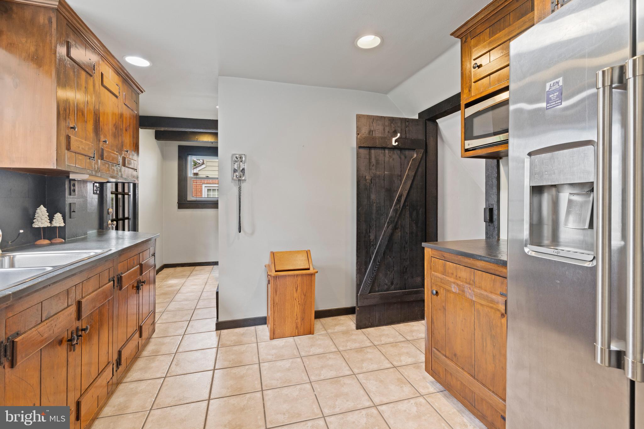 1508 Niessen Road Oreland, PA 19075 - Photo 11 of 44 a kitchen with stainless steel appliances a refrigerator and cabinets