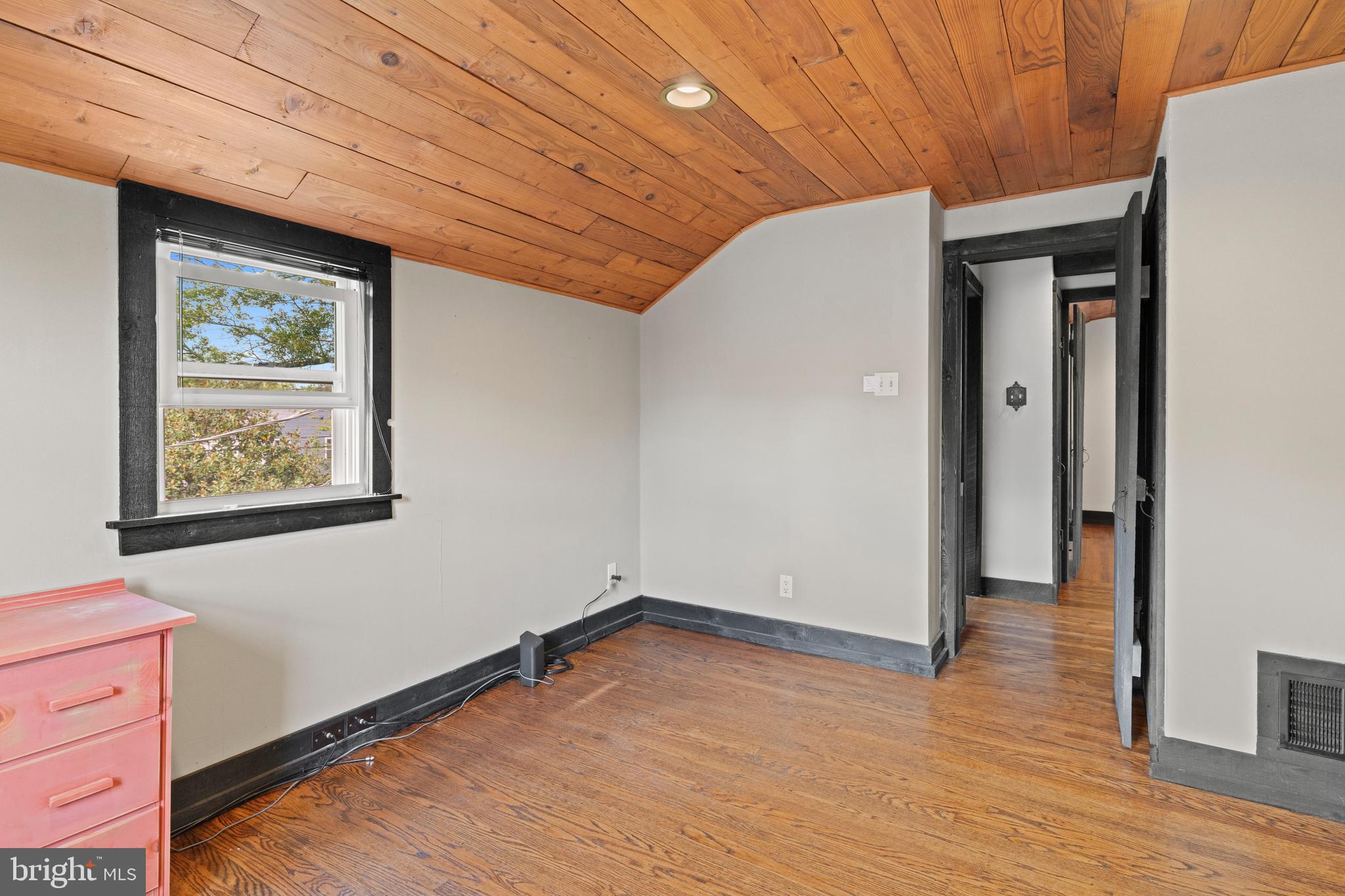 1508 Niessen Road Oreland, PA 19075 - Photo 15 of 44 a view of an empty room with wooden floor and a window