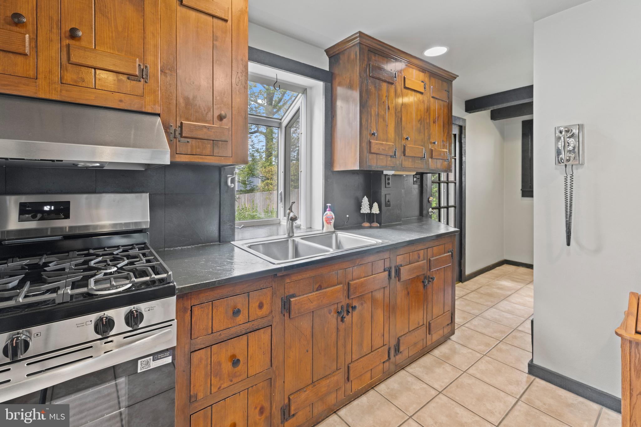 1508 Niessen Road Oreland, PA 19075 - Photo 8 of 44 a kitchen with stainless steel appliances granite countertop a stove a sink and a refrigerator