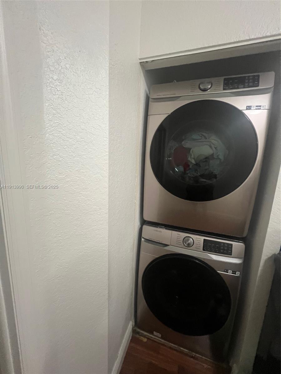 8948 Southwest 19th Street, Unit 909 Miramar, FL 33025 - Photo 13 of 31 a utility room with dryer and washer
