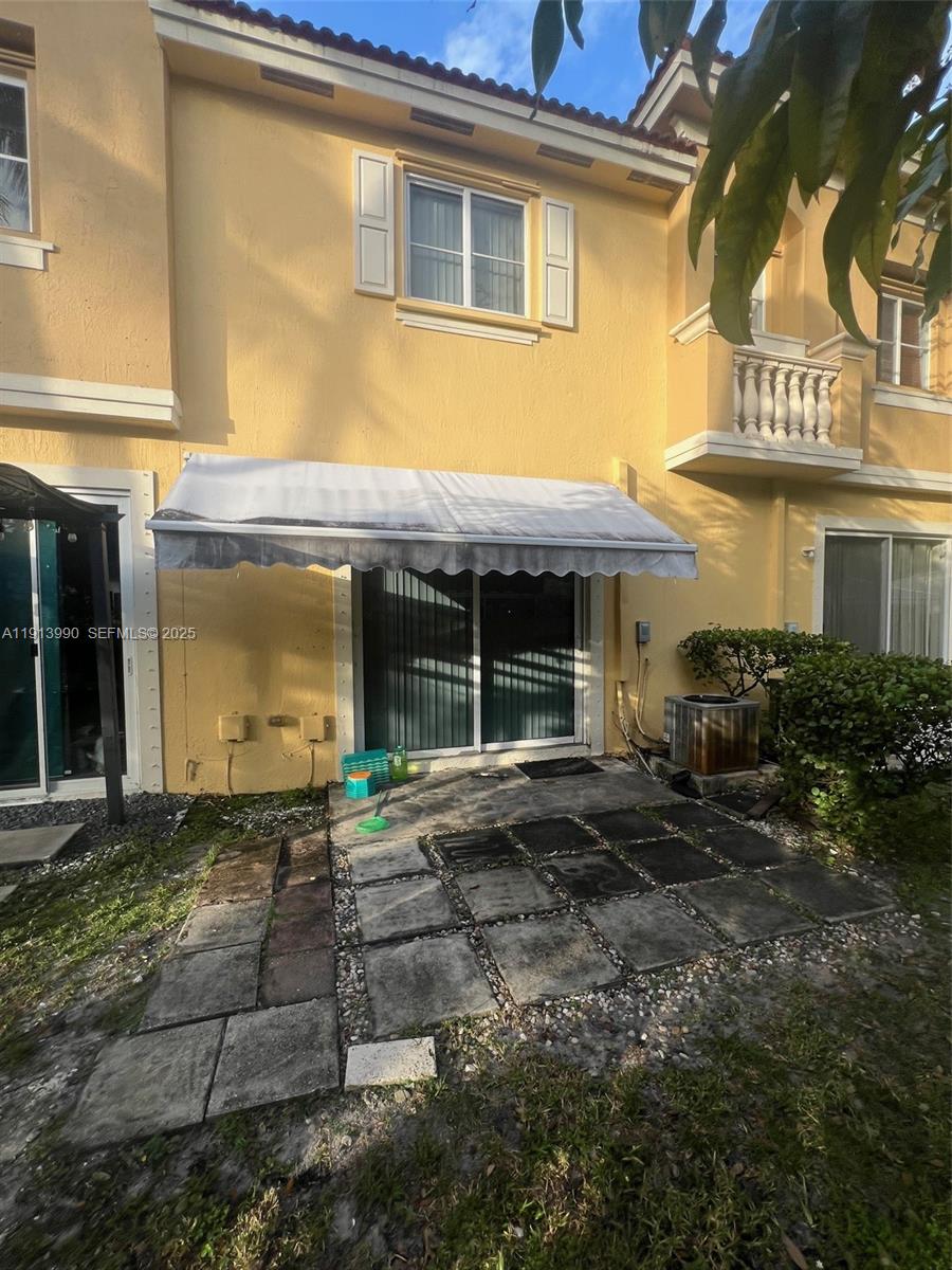 8948 Southwest 19th Street, Unit 909 Miramar, FL 33025 - Photo 16 of 31 front view of a brick house with a large window