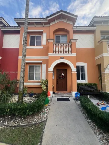 a kitchen with stainless steel appliances granite countertop a refrigerator stove and sink