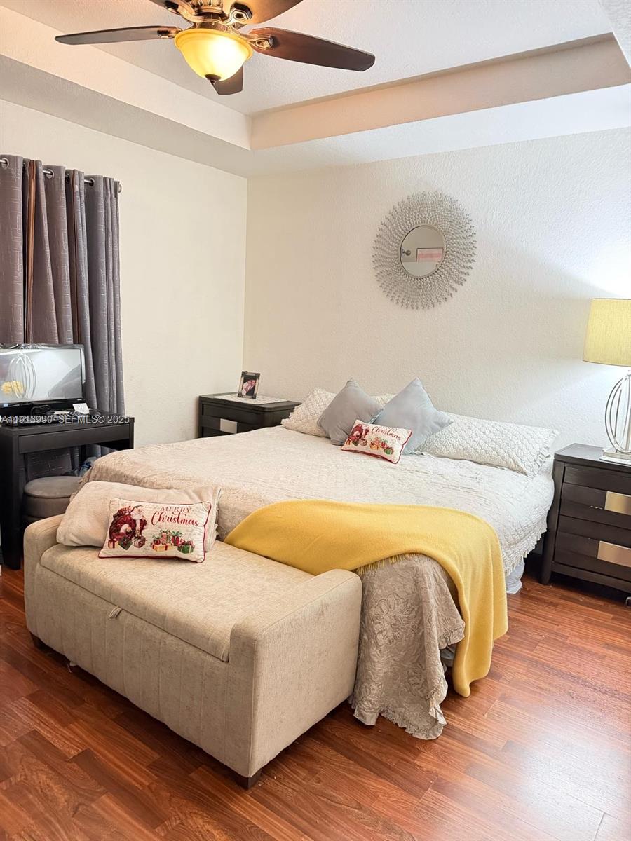 8948 Southwest 19th Street, Unit 909 Miramar, FL 33025 - Photo 7 of 31 a bedroom with bed and window