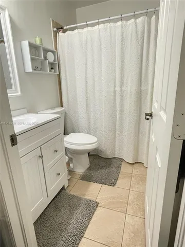 a bathroom with a toilet and a sink