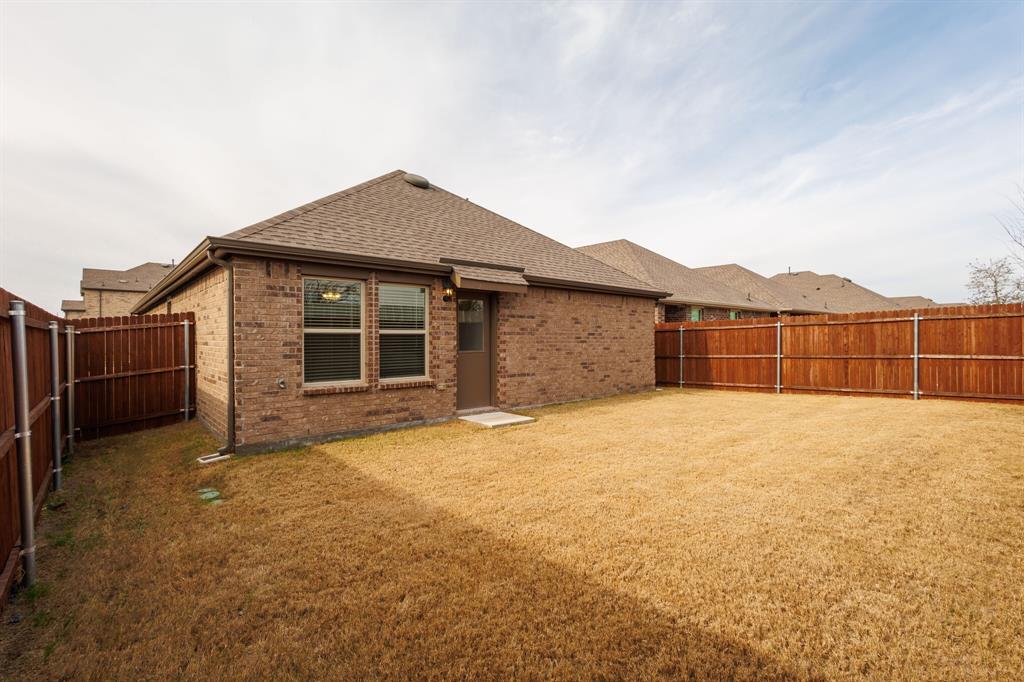 806 Ramble Road Lavon, TX 75166 - Photo 19 of 24 a view of a house with backyard and garden