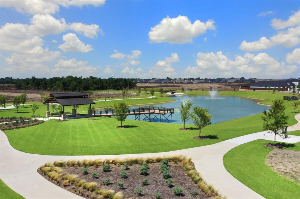 806 Ramble Road Lavon, TX 75166 - Photo 23 of 24 a view of a golf course with a lake view