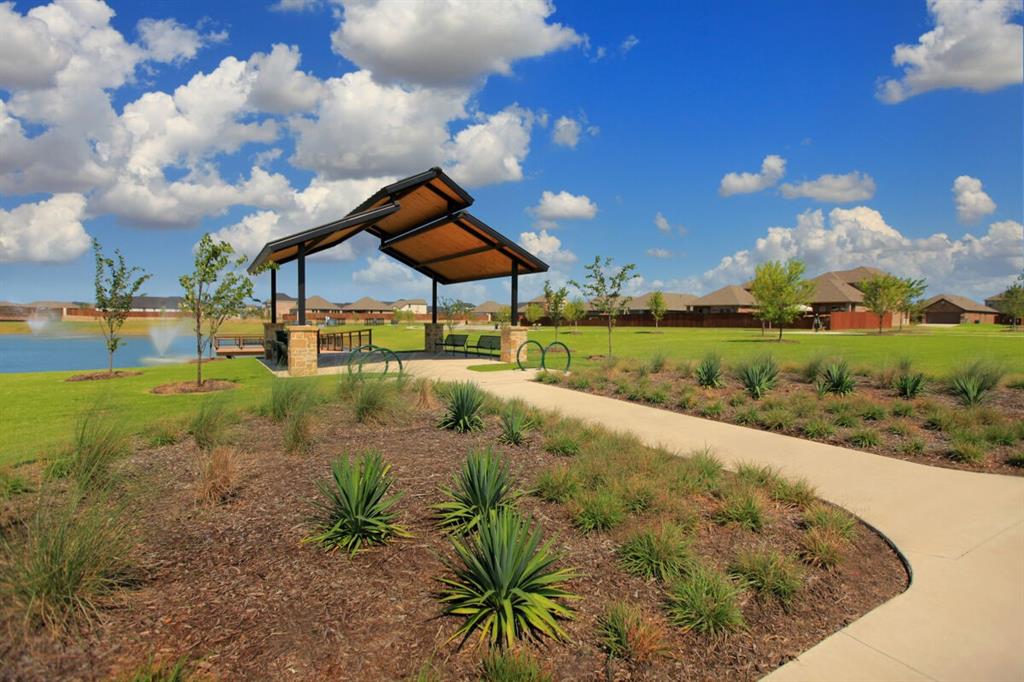 806 Ramble Road Lavon, TX 75166 - Photo 4 of 24 a view of a garden with a house