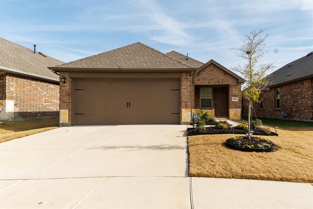 806 Ramble Road Lavon, TX 75166 - Photo 5 of 24 a front view of a house with garden