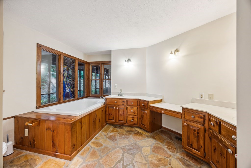 101 Menagerie Ridge Epworth, GA 30541 - Photo 12 of 48 a room with a bed and a cabinets