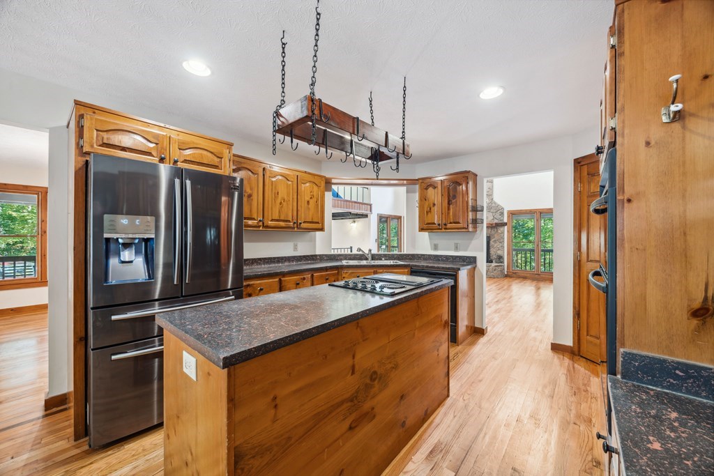 101 Menagerie Ridge Epworth, GA 30541 - Photo 19 of 48 a kitchen with stainless steel appliances granite countertop a stove and a refrigerator