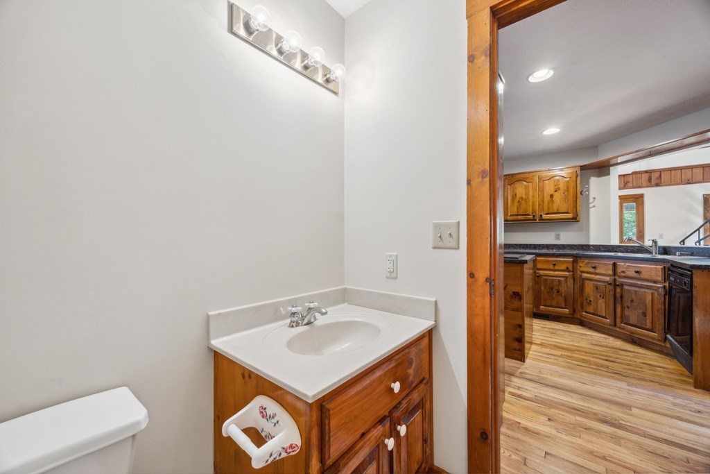 101 Menagerie Ridge Epworth, GA 30541 - Photo 23 of 48 a bathroom with a sink a toilet and mirror