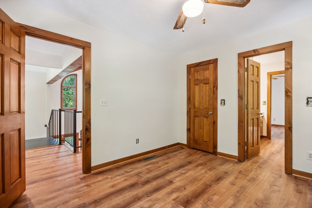 101 Menagerie Ridge Epworth, GA 30541 - Photo 27 of 48 a view of a hallway with wooden floor and closet