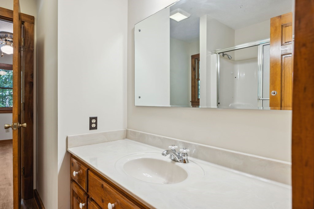 101 Menagerie Ridge Epworth, GA 30541 - Photo 30 of 48 a bathroom with a sink and a mirror