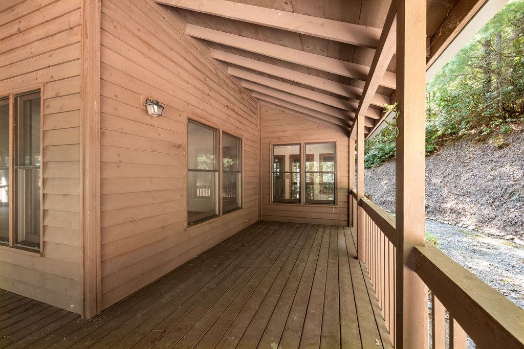 101 Menagerie Ridge Epworth, GA 30541 - Photo 46 of 48 a view of a balcony with wooden floor and iron stairs