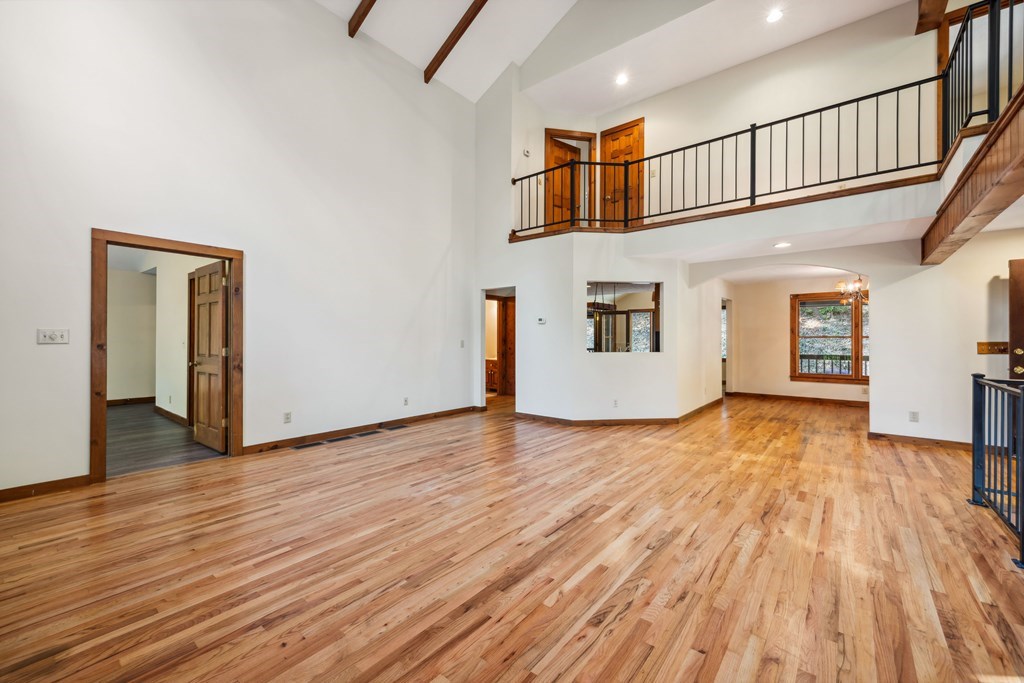 101 Menagerie Ridge Epworth, GA 30541 - Photo 7 of 48 a view of empty room with wooden floor