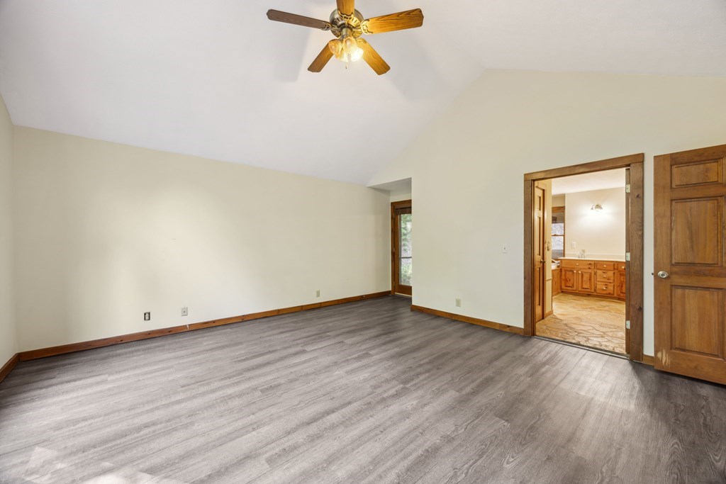 101 Menagerie Ridge Epworth, GA 30541 - Photo 9 of 48 a view of empty room with wooden floor and fan