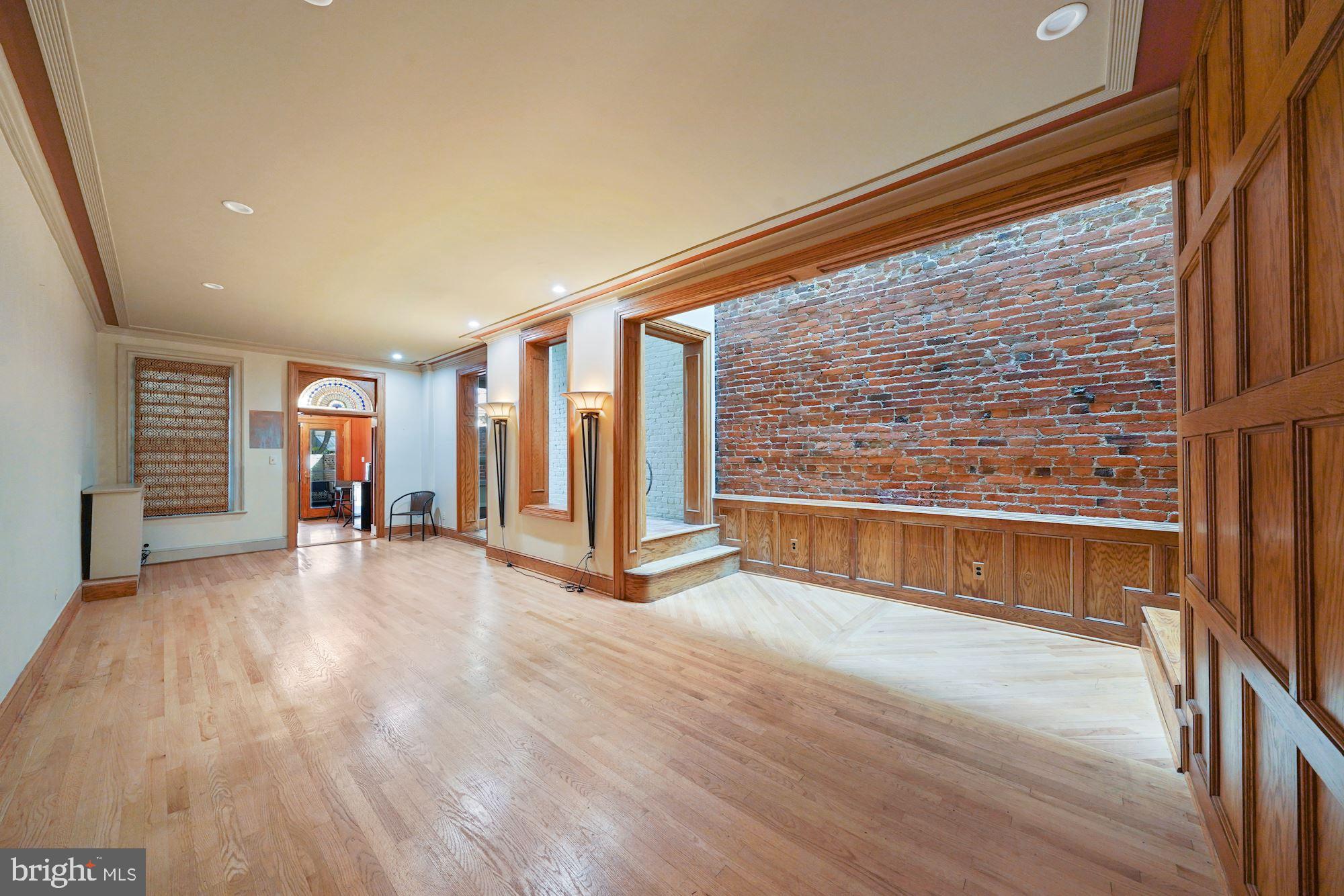 514 Seward Square Southeast Washington, DC 20003 - Photo 6 of 30 Huge entertainment space with exposed brick