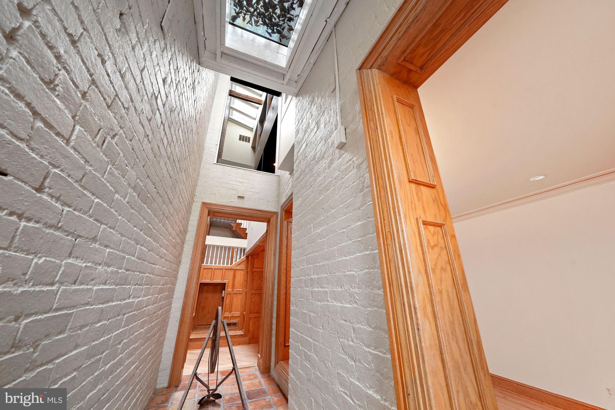 514 Seward Square Southeast Washington, DC 20003 - Photo 10 of 30 Exposed brick with skylights