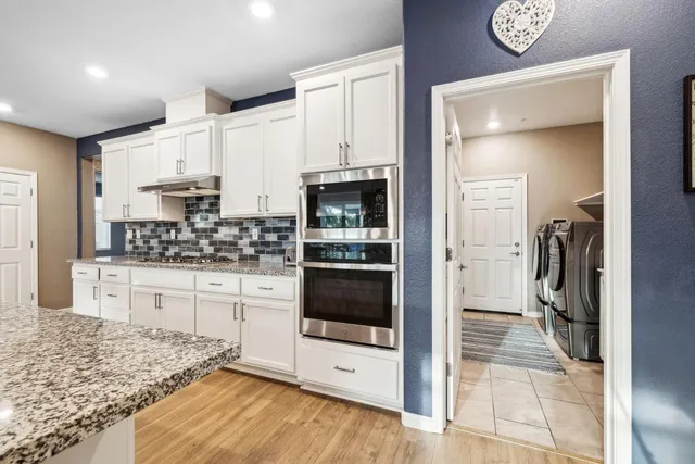a hallway with washer and dryer