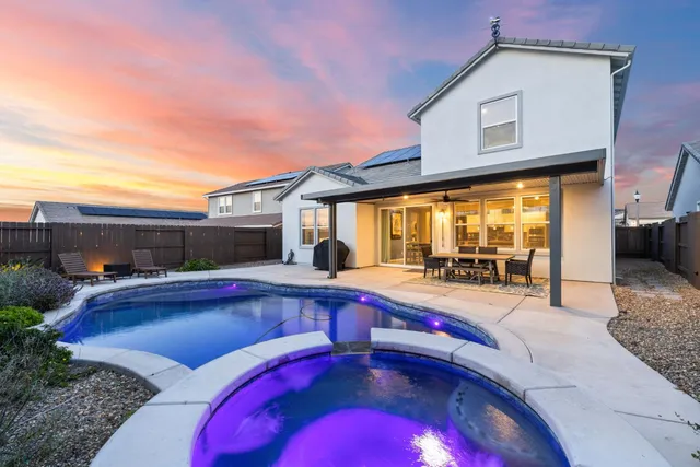 a view of swimming pool with outdoor seating