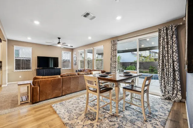 a spacious bedroom with a bed and a mirror