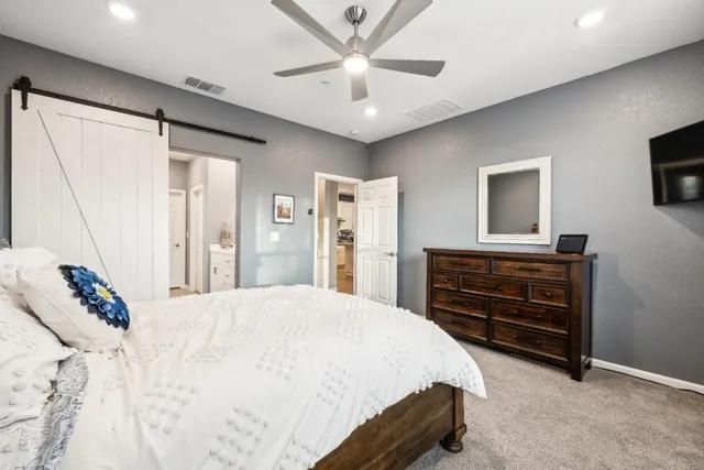 a en suite bathroom with double vanity and a mirror