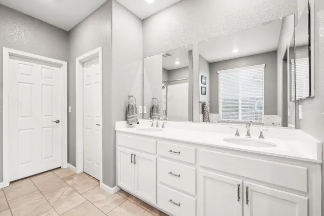 a view of a house with swimming pool and sitting area