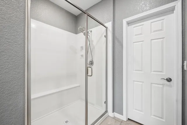 a view of a house with swimming pool and sitting area