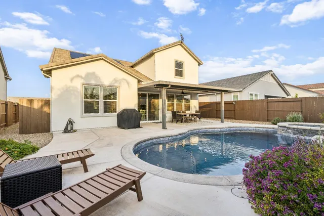 a room with furniture and a potted plant