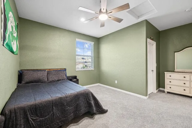 an aerial view of a house with a swimming pool