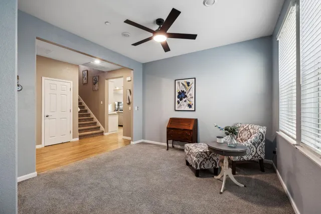 a living room with furniture and a window