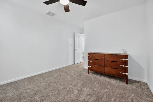 a building outdoor space with patio furniture and garden