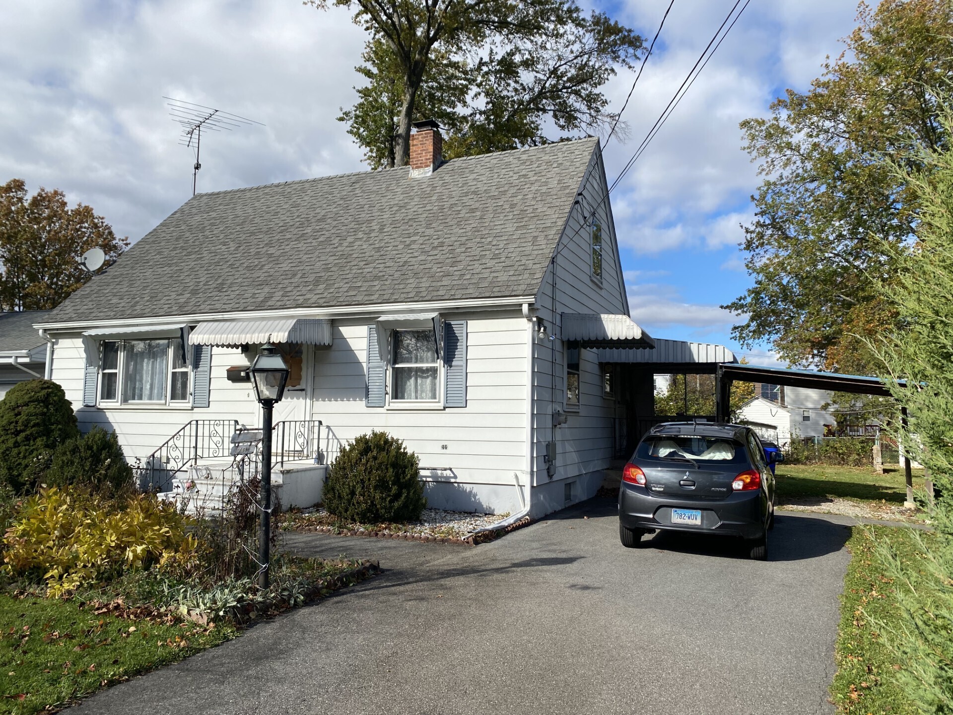 a car parked in front of a house