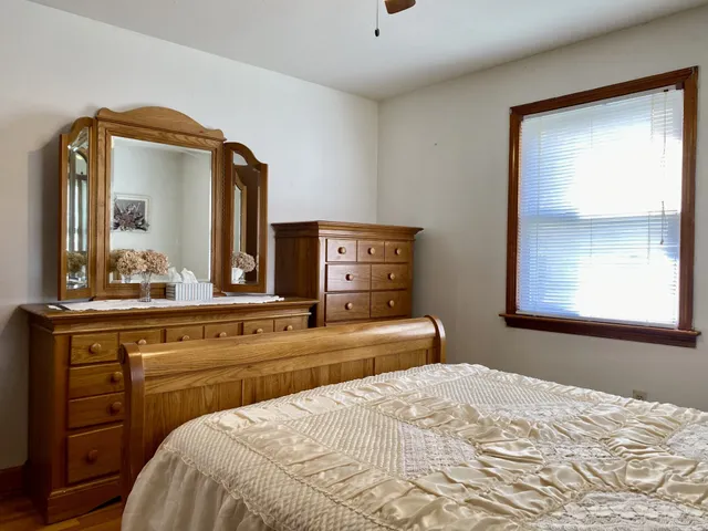 a bedroom with a bed and a dresser