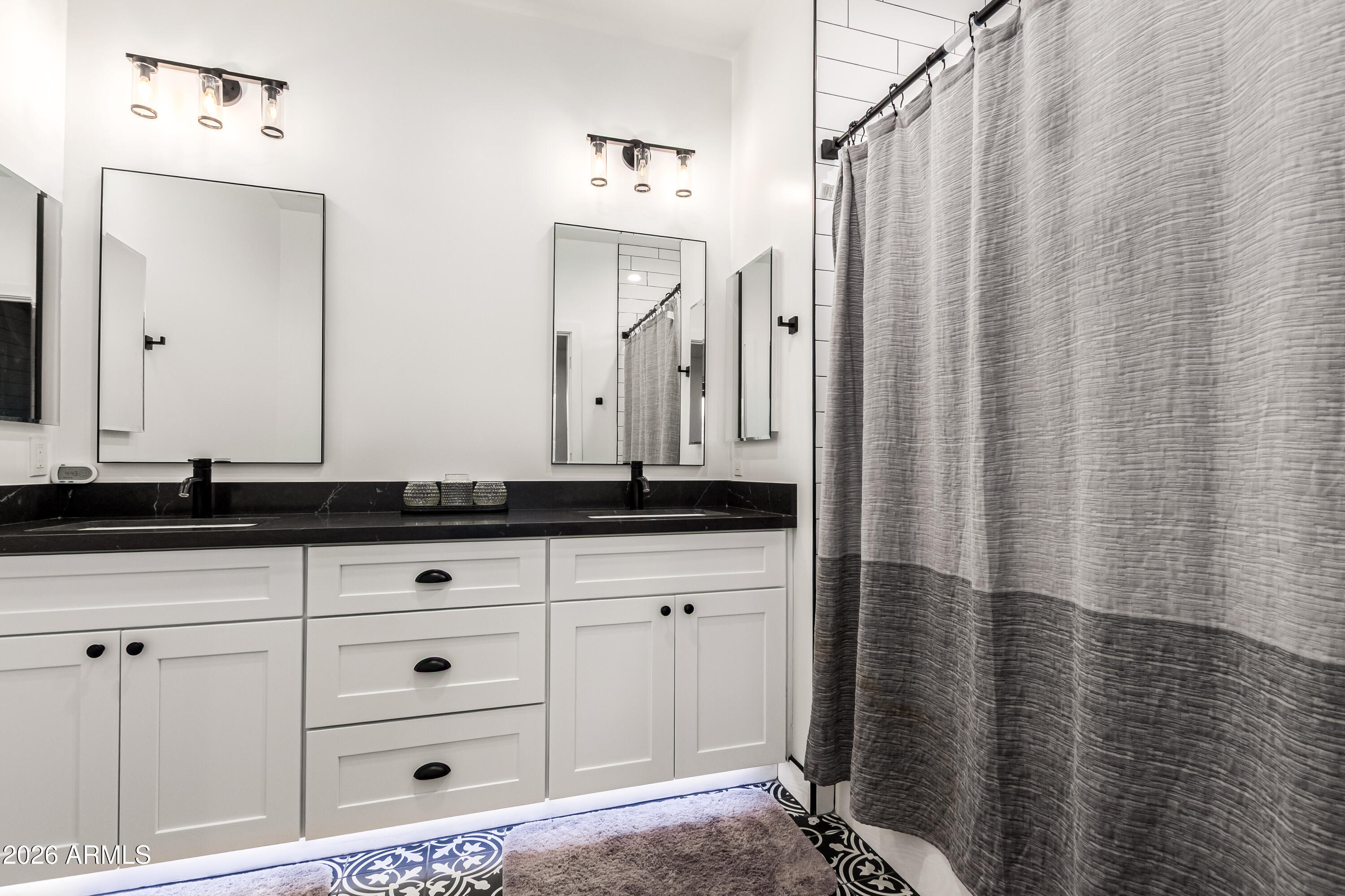 990 North Muleshoe Road Apache Junction, AZ 85119 - Photo 18 of 34 a bathroom with a sink and a mirror