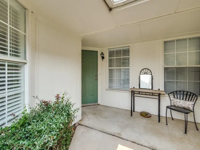 a house view with a seating space and garden space