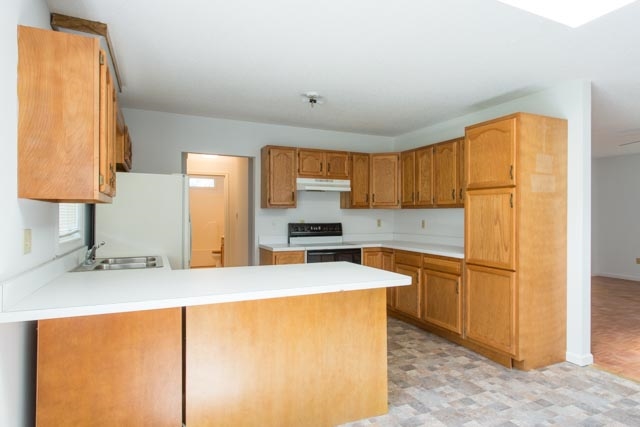 239 South River Road Grottoes, VA 24441 - Photo 3 of 25 a kitchen with stainless steel appliances granite countertop a sink refrigerator and microwave