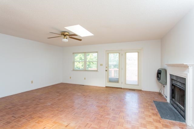 239 South River Road Grottoes, VA 24441 - Photo 5 of 25 a view of empty room with a fireplace and fan