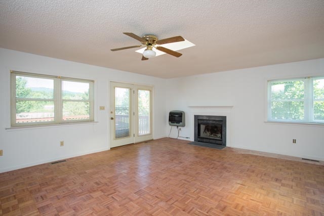 239 South River Road Grottoes, VA 24441 - Photo 8 of 25 a view of a livingroom with a fireplace and windows