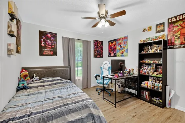 a bedroom with a bed and furniture