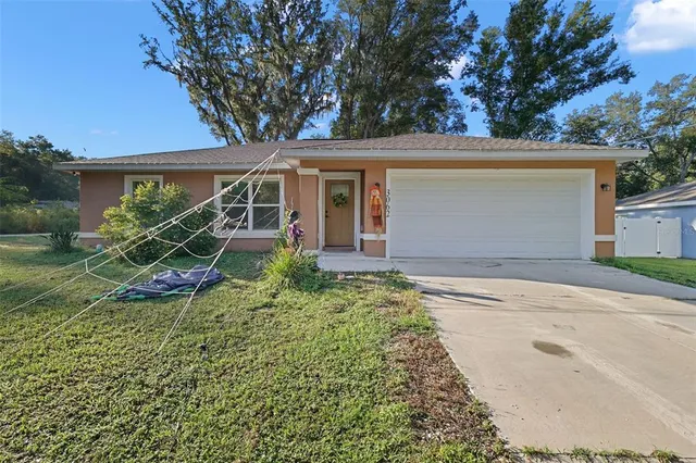 front view of a house with a tree