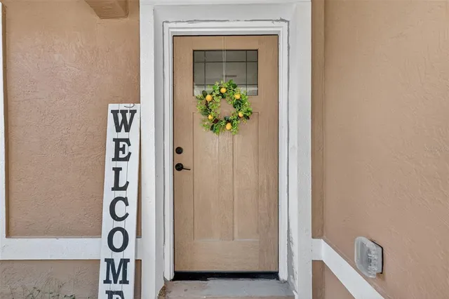 a view of an entryway with wooden floor