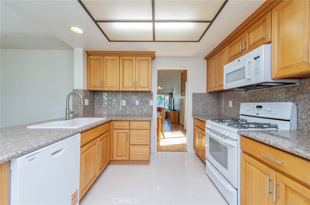 19621 Running Brand Circle Walnut, CA 91789 - Photo 11 of 40 a kitchen with stainless steel appliances granite countertop a sink stove and cabinets