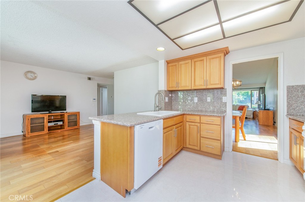 19621 Running Brand Circle Walnut, CA 91789 - Photo 12 of 40 a large kitchen with stainless steel appliances granite countertop a stove and a sink with cabinets